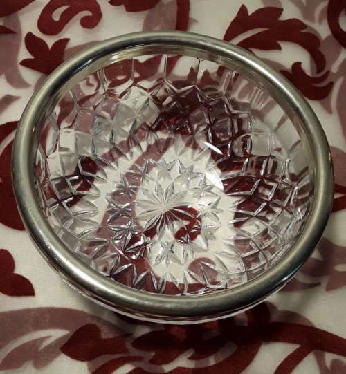 Sought after small glass bowl with EP rim. Stamped England on the inside.