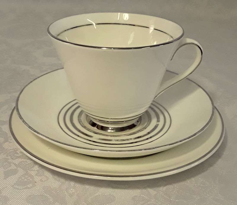 Vintage sophisticated white with silver  Royal Doulton trios (four)