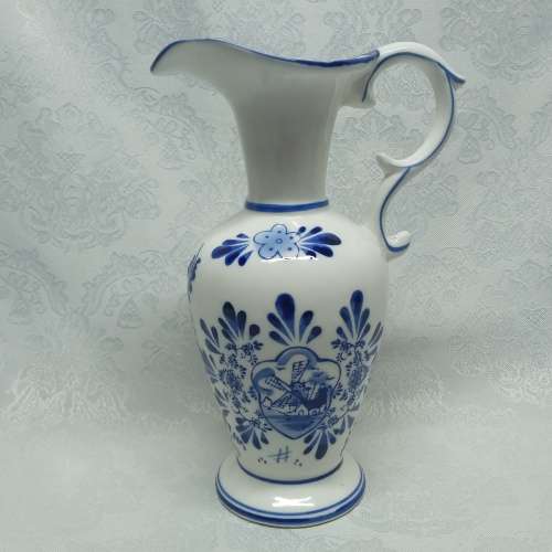 Delft like jug with Holland scene.