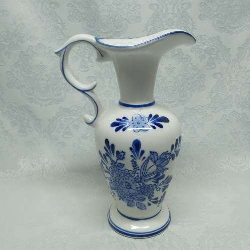 Delft like jug with Holland scene.
