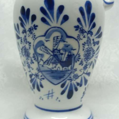 Delft like jug with Holland scene.