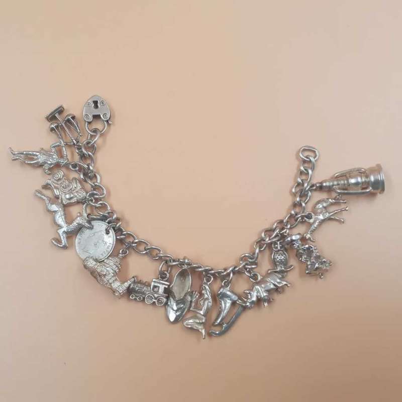 Vintage Sterling Silver Charm Bracelet with a padlock closure.