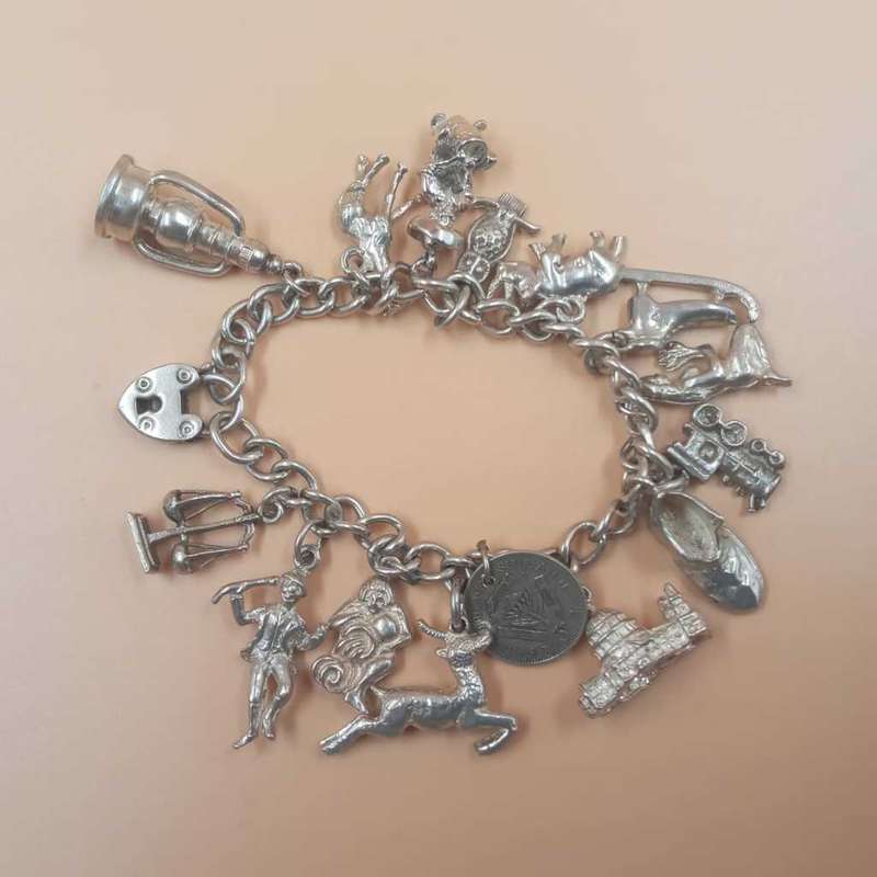 Vintage Sterling Silver Charm Bracelet with a padlock closure.
