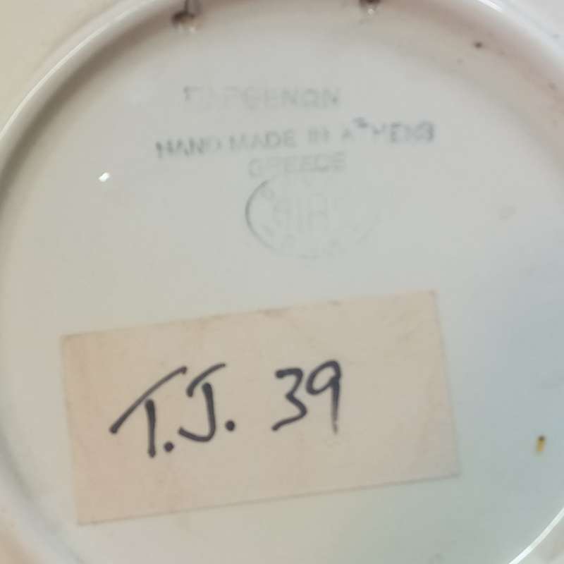 Two vintage handmade ceramic plates made in Athens, Greece.