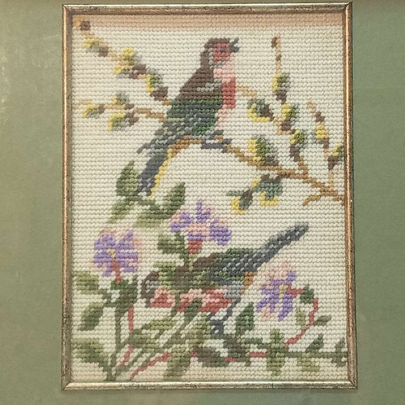 Tapestry of birds and flowers, framed with a green background and wood frame