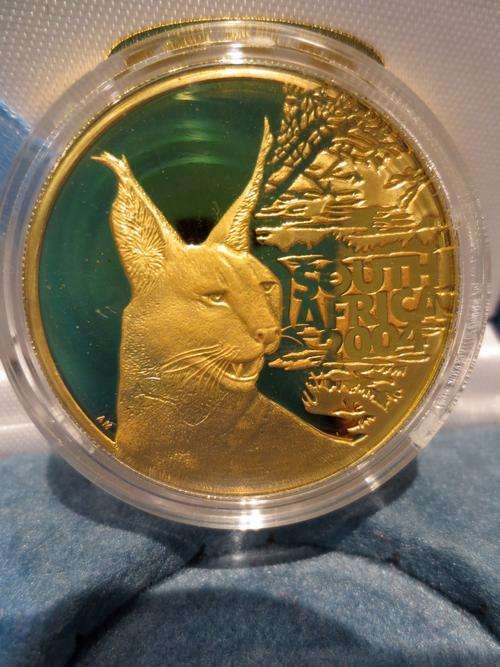 ## CRAZY R1 ## 2004 Natura Caracal 1oz Gold 24 Carat (999.99)