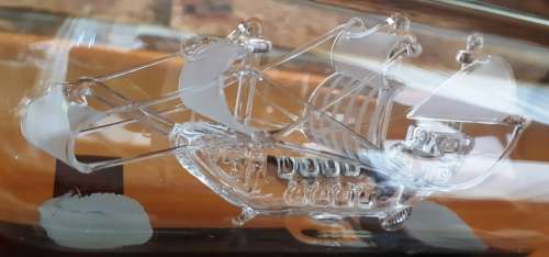 Santa Maria 1492 May Flower glass model ship in bottle on wooden stand-Made in Britain-good cond.