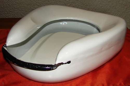 Vintage white enamel bed pan with black trimmings in good condition