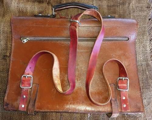 Genuine vintage good quality leather brief case with back carry straps