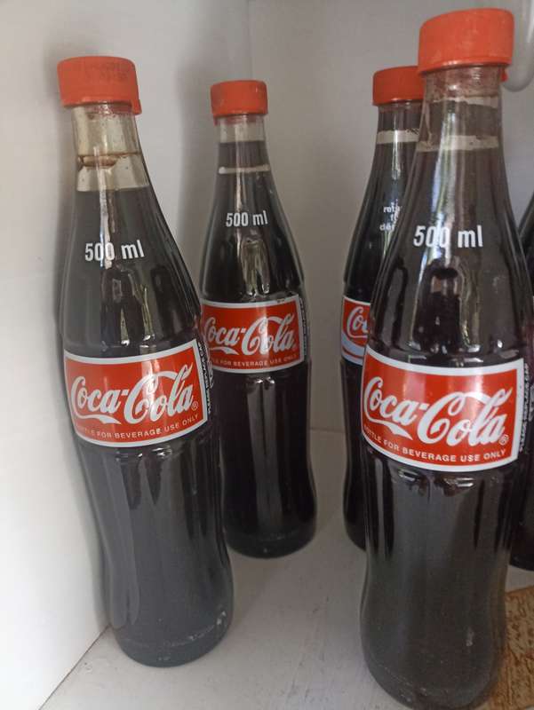 Lot-7- 500ml Coca Cola bottles-1995 Coca Cola Company-filled with substitute