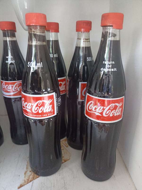 Lot-7- 500ml Coca Cola bottles-1995 Coca Cola Company-filled with substitute