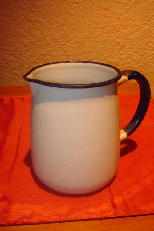 Vintage white Enamel Milk Jug with Blue trimming - height 13cm
