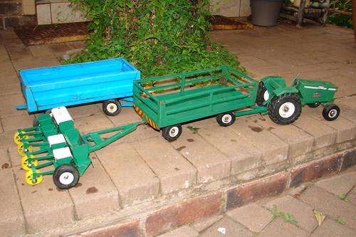4 Piece good quality Viitage Olti steel farm toys from the 80`s-Tractor, Plough and two wagons
