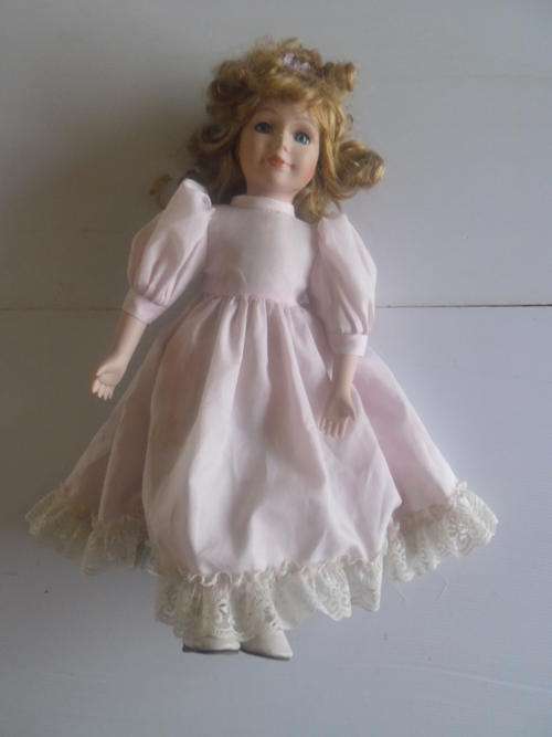 PORCELAIN DOLL. PLEASE READ DISCRIPTION?