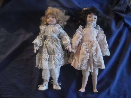 2X PORCELAIN  DOLLS. ONE BID. READ DISCRIPTION?