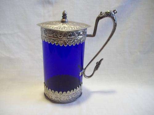 This lovely  blue glass jug with decorative cast metal fixtures - Old