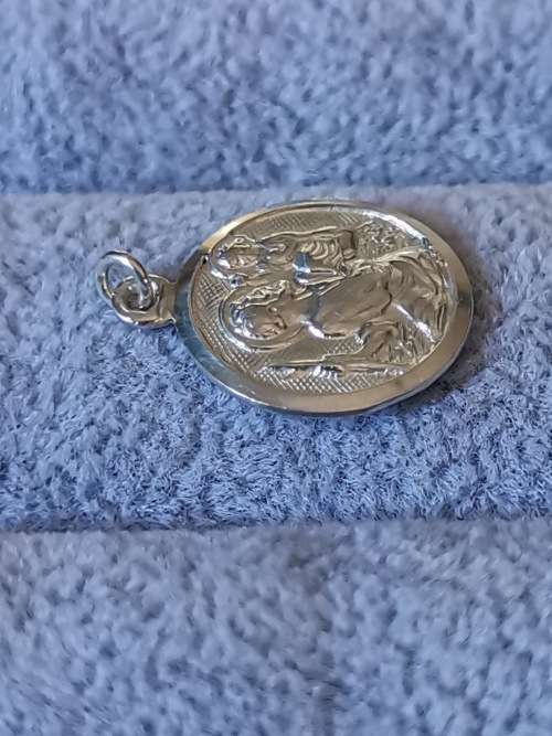 **R1 Auction**  Silver St. Christopher Pendant