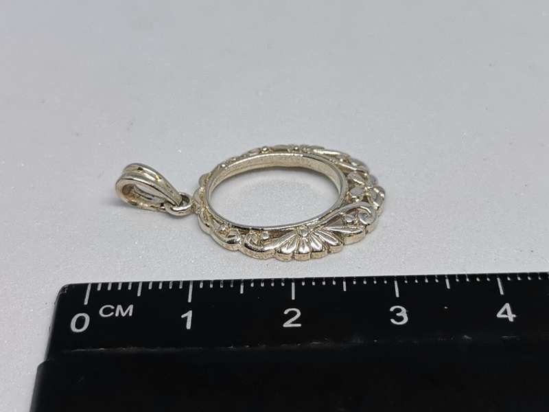 Detailed Silver Pendant