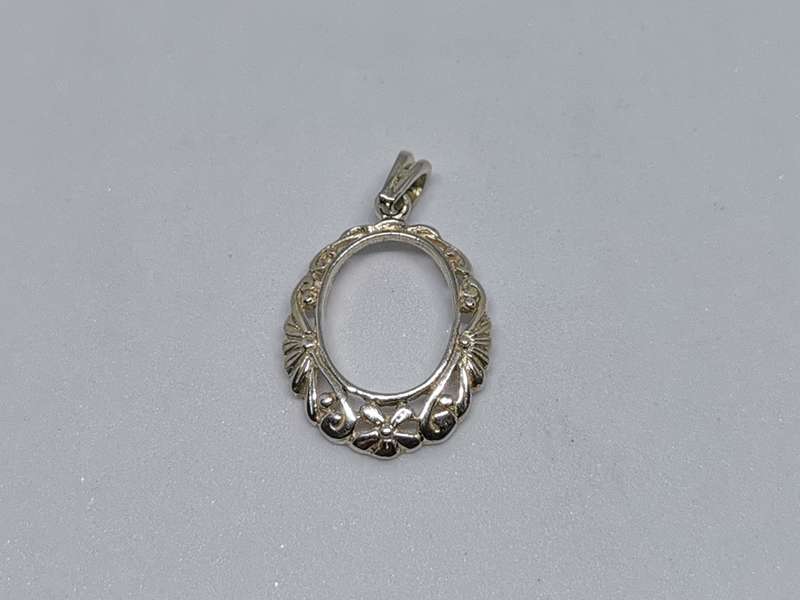 Detailed Silver Pendant