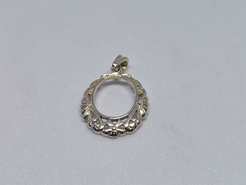 Detailed Silver Pendant