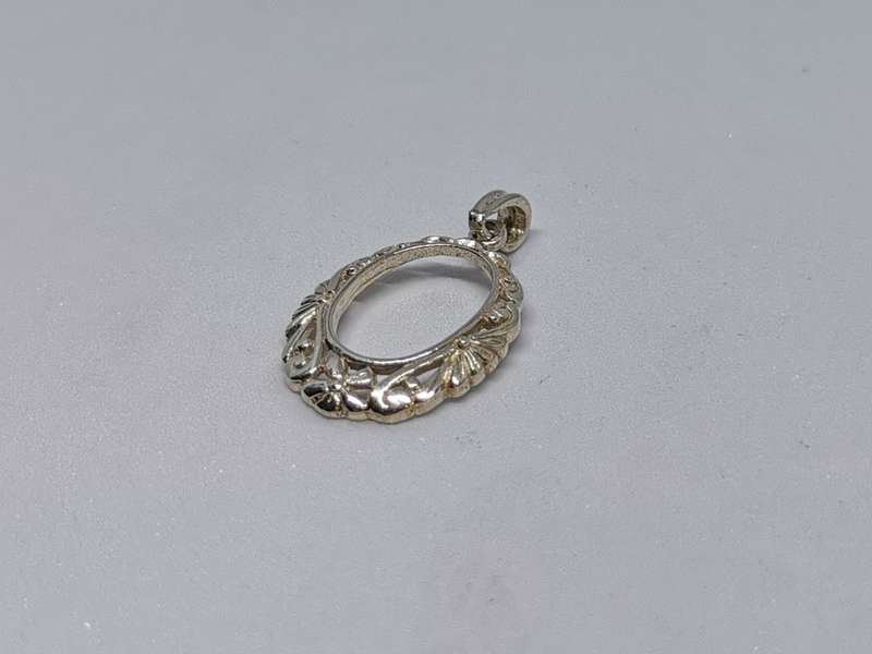 Detailed Silver Pendant