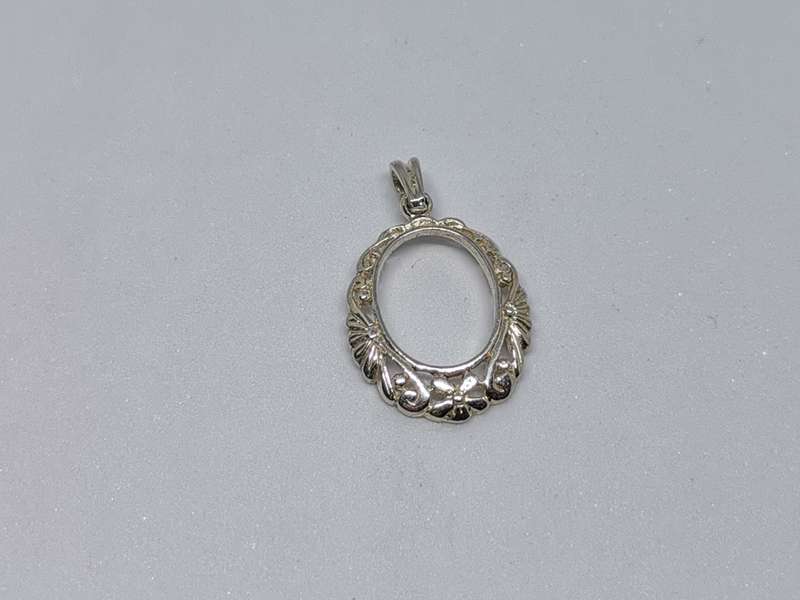 Detailed Silver Pendant
