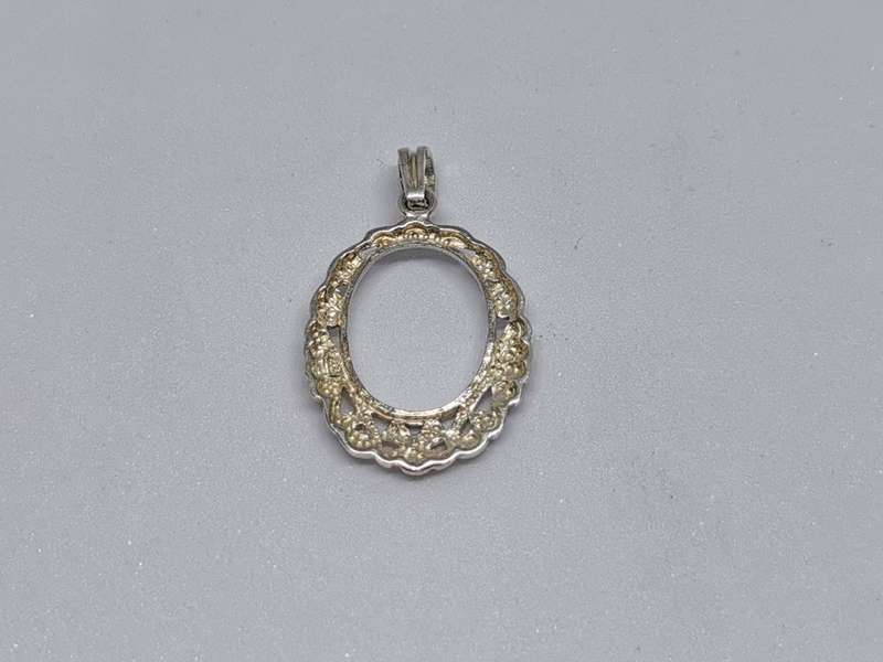 Detailed Silver Pendant