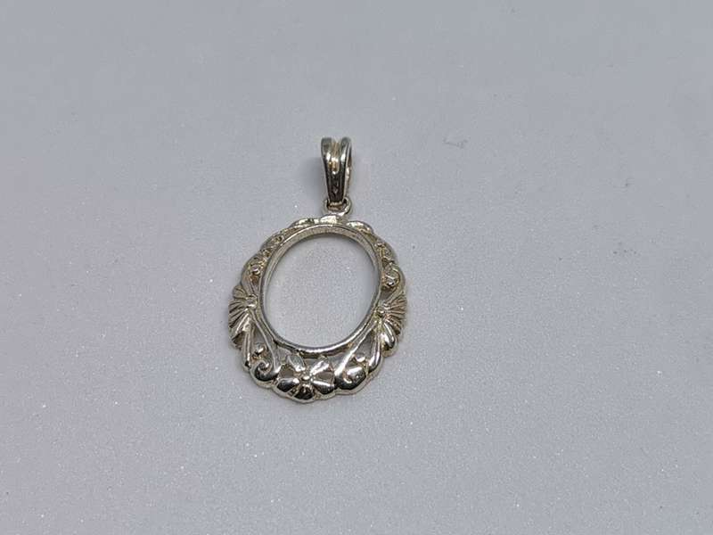 Detailed Silver Pendant