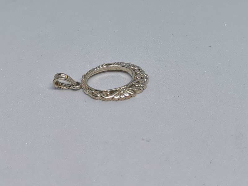 Detailed Silver Pendant