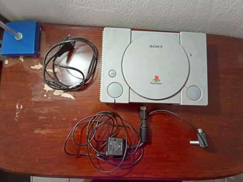 Old PS1 console with cables and 2 games(not tested)