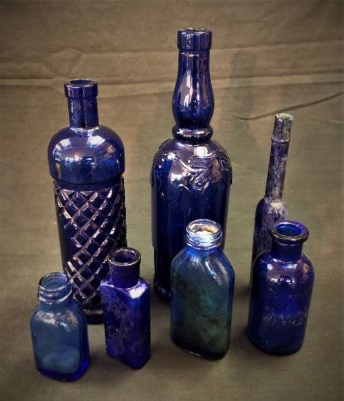 Lot of Seven Blue Glass Bottles
