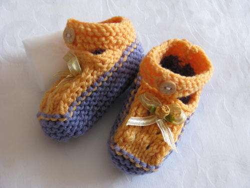 Beautiful orange and purple little booties 0-6 months