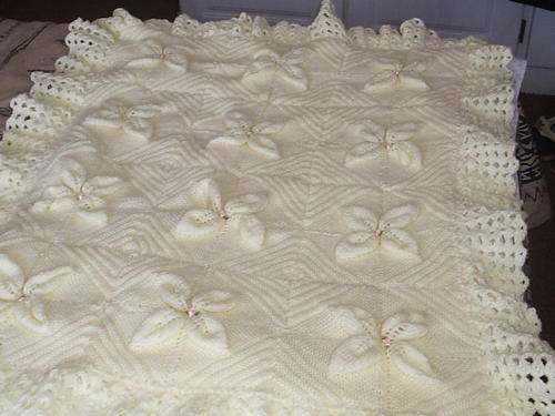 Beautiful hand-knitted baby blanket in pale yellow
