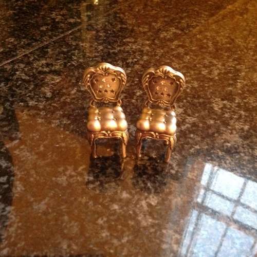 2 Mini silver plated chairs .see all pictures bid per each to take the 2. Postage R50.