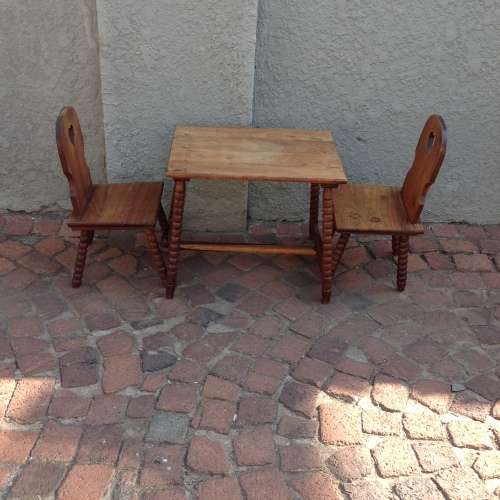 Kids solid oak table and 2 chairs  in good condition needs a clean and polish see pics.