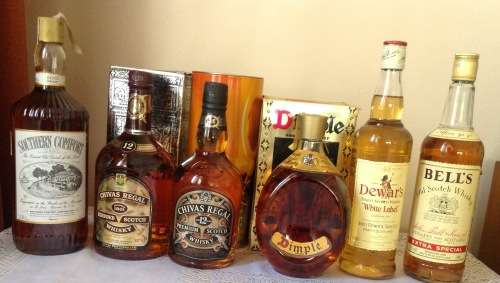 21 BOTTLES OF ASSORTED WHISKEY UP FOR GRABS . SEE PICTURES AND DESCRIPTION.