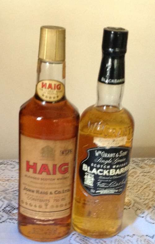 21 BOTTLES OF ASSORTED WHISKEY UP FOR GRABS . SEE PICTURES AND DESCRIPTION.