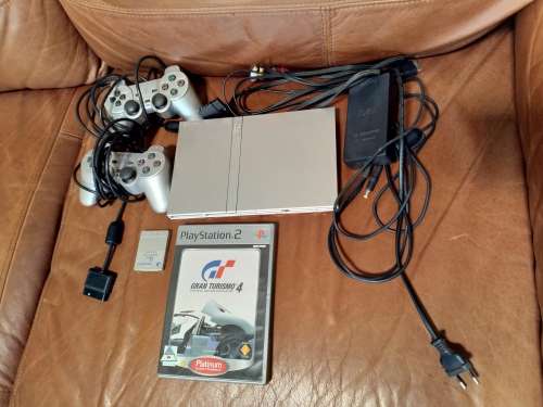 Playstation 2 Slim (Silver) with 2x controllers, memory card, power supply, cables and GT4