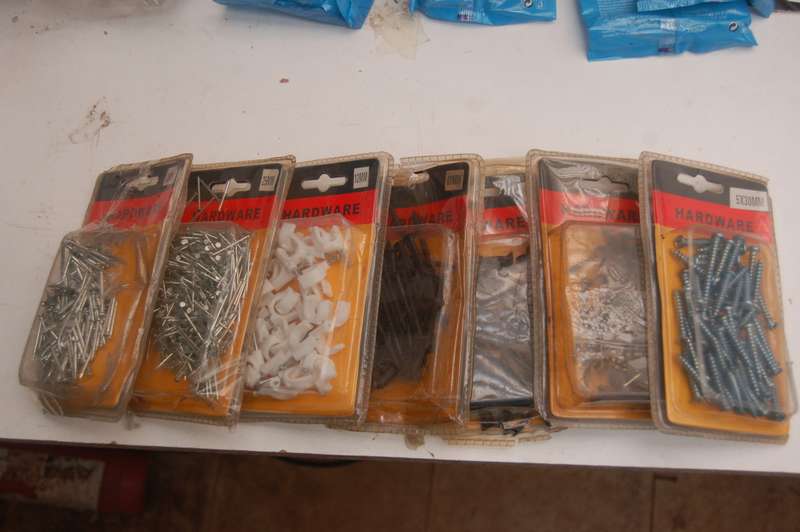 ASSORTED PIN NAILS BLACK SCREWS ROUND TOP STEEL SCREWS AND CABLE CUPHOLDERS