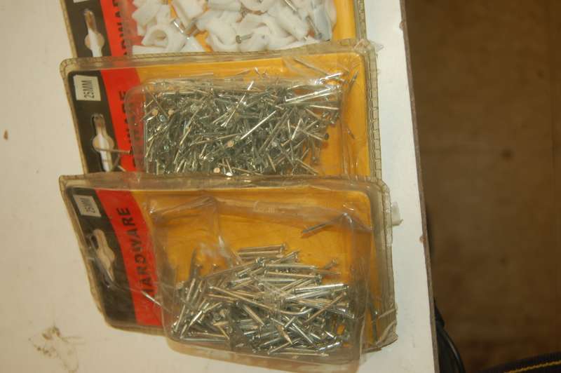 ASSORTED PIN NAILS BLACK SCREWS ROUND TOP STEEL SCREWS AND CABLE CUPHOLDERS
