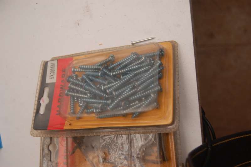 ASSORTED PIN NAILS BLACK SCREWS ROUND TOP STEEL SCREWS AND CABLE CUPHOLDERS