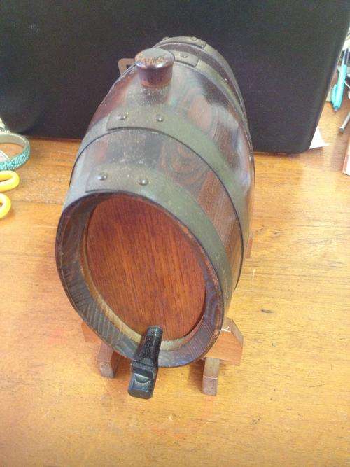 A nice unusual oval shaped oak and brass barrel