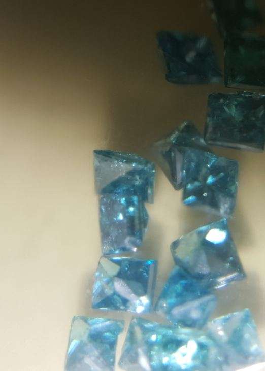 +- 0.31 carat square blue pointer diamonds