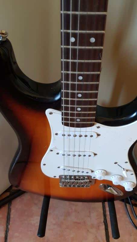 squier by fender 6 string electric guitar on auction