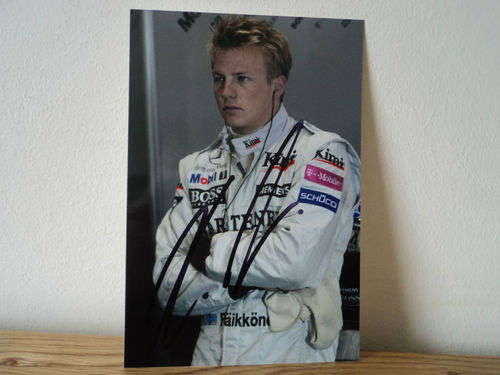 Official hand signed Kimi Raikonen photo. Authentic F1 Mercedes memorabilia.