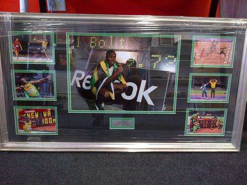 REDUCED.Hand signed Usain Bolt montage rare item.