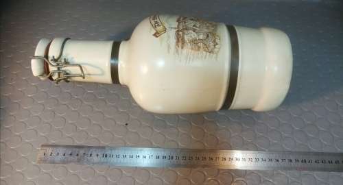 Very large beautiful ceramic and brass wine bottle