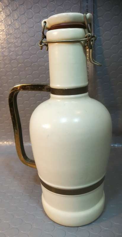Very large beautiful ceramic and brass wine bottle