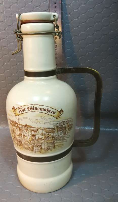 Very large beautiful ceramic and brass wine bottle