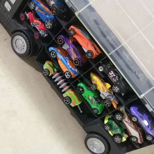 HUGE HOT WHEELS STORAGE TRUCK FILLED ON BOTH SIDES WITH HIGHLY COLLECTIBLE HOT WHEELS CARS